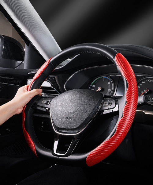 Carbon fiber steering wheel cover — packaged product photo.